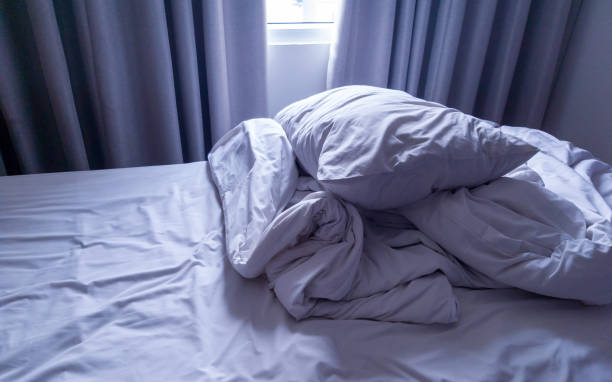 istock stack of pillow and bed cover at the corner of bed 1370430084