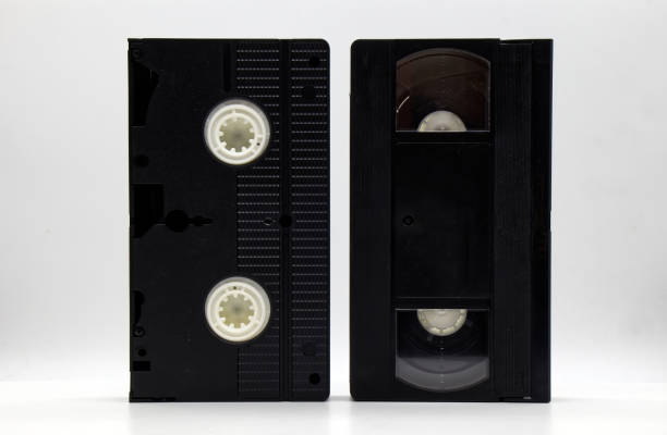 istock Vintage VHS video tape cassette on white background. Retro style technology from the 90s 1370430610