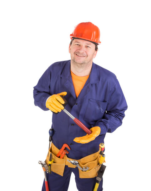 istock A worker in a hard hat holds a hammer. 1370431020