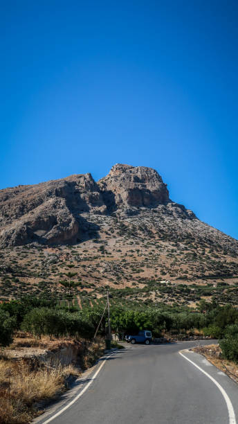 istock Rocky mountains with curving road in Keratokampos, Crete 1370431449