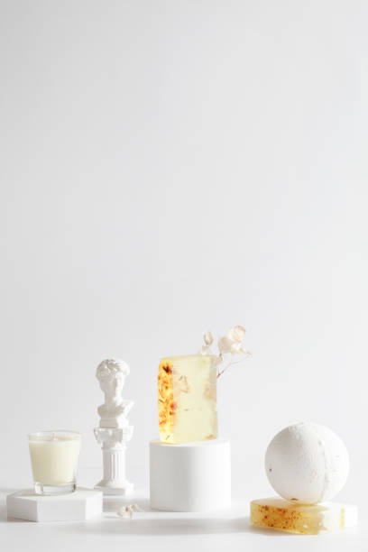 istock bath bomb, candle and handmade soap on podium on white background. Still life for wall decoration in resort spa or salon.Spa,relax, wellness concept. 1370433044