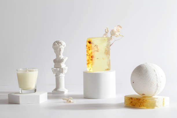 istock bath bomb, candle and handmade soap on podium on white background. Still life for wall decoration in resort spa or salon.Spa,relax, wellness concept. 1370433054