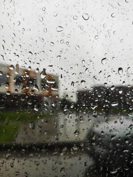 istock car mirror through glass with drops in the dark 1370434516