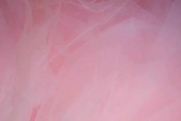 istock delicate airy white fabric with folds on a pink background 1370438274