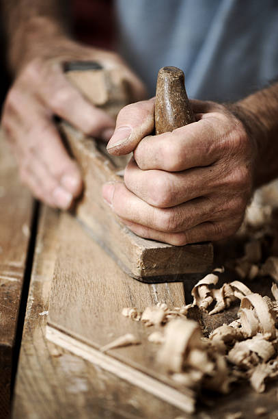 istock hands of a carpenter, close up 137043949