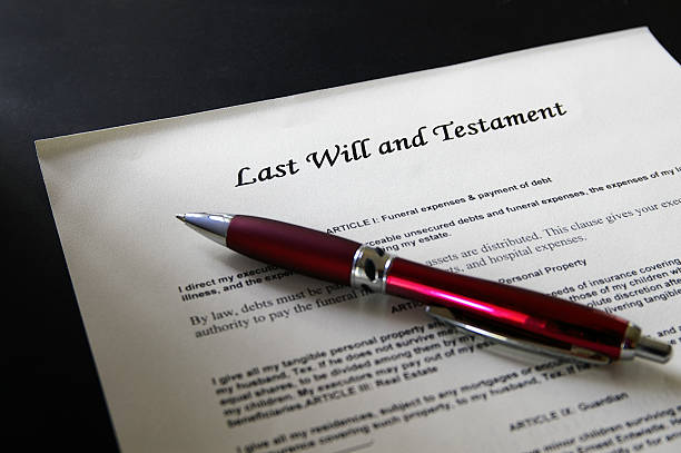 istock Red pen lying atop a last will and testament 137044078