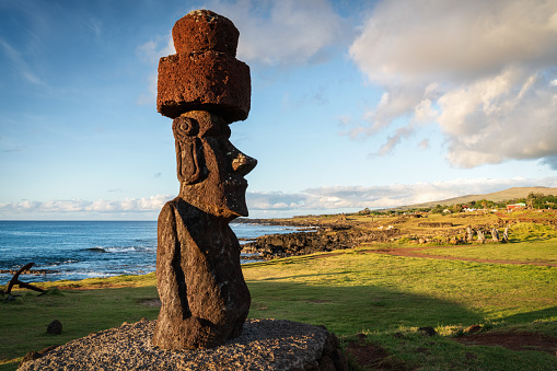 Easter Island Hanga Roa Moai by the Sea  Panorama. Tahai Ceremonial Complex of the Hanga Road Coast under sunny summer skyscape. The Tahai Ceremonial Complex is an archaeological site on Rapa Nui in Chilean Polynesia. Hanga Roa, Rapa Nui National Park, Easter Island - Isla de Pascua, Chilenean Polynesia, Chile