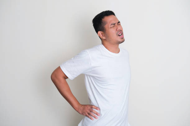 istock Adult Asian man wearing white plain tshirt suffer low back pain 1370442592