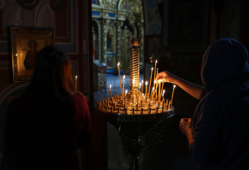 People praying in church in Ukraine