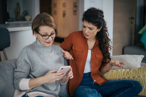 Young woman is arguing with her mother stock photo