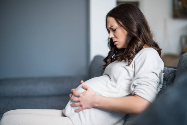 istock Pregnant woman at home 1370447762