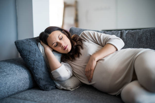 istock Pregnant woman at home 1370448123