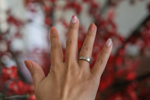 Cropped shot of unrecognizable married woman hands showing her wedding ring