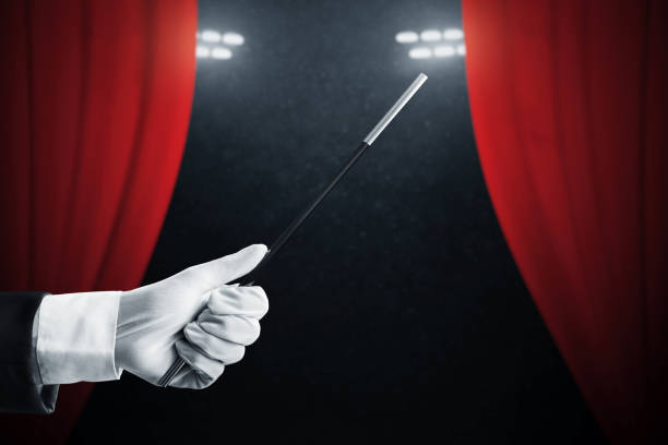 Magician hand holding magic wand