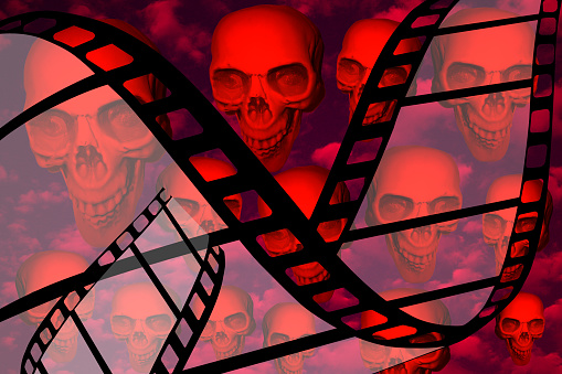 Horror film  Human skulls in the background  Film reel  Cinema
