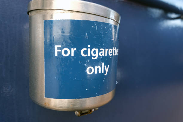 istock Windproof metal ashtray outdoors on a blue wall 1370452902