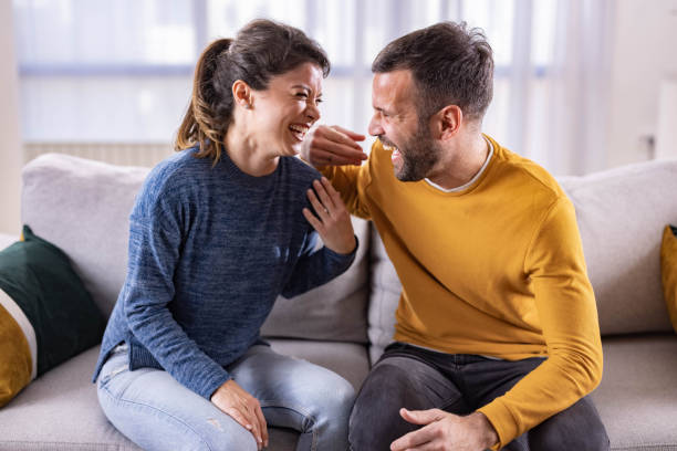 istock Cheerful couple talking at home. 1370455427