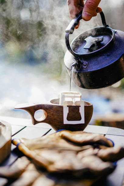istock Coffee break with drip coffee on the forest, ground coffee on the filter paper 1370456477