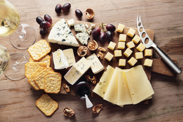istock Different arts of cheese with grape on wooden 1370457050