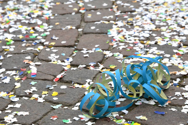 streamers and confetti on the ground during the carnival period in february stock photo
