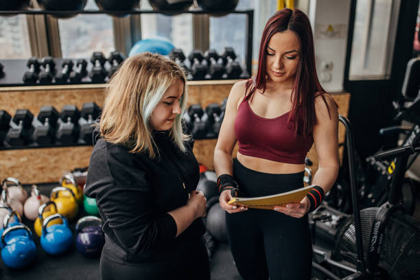 istock Fitness trainer and client 1370460160