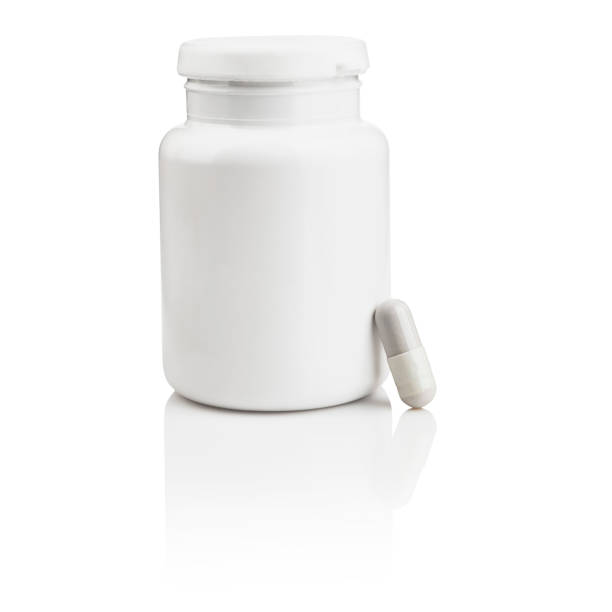 istock White pills bottle and a capsule 1370461041