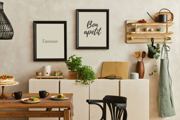 istock Stylish composition of cozy kitchen interior design with mock up poster frames, beige commode, wooden dinind table and retro inspired kitchen accessories. Template.