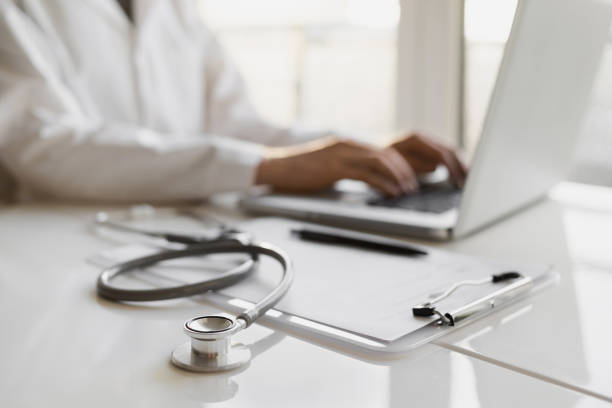 istock Work place of doctor, physician, therapist or practitioner, focus on stethoscope 1370462577
