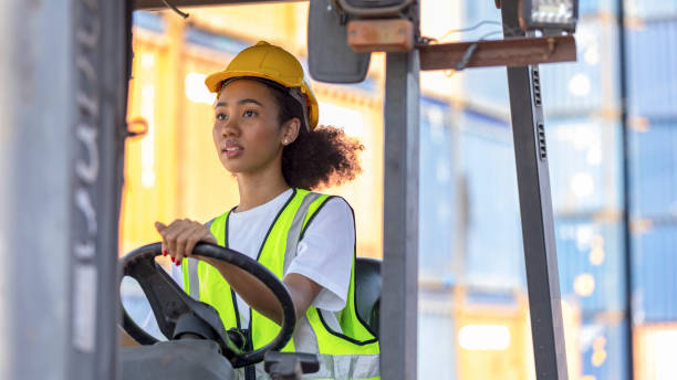 istock Young African American mechanical engineer with forklift 1370462665