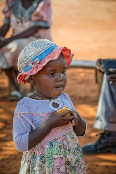 istock African child eating 1370462717