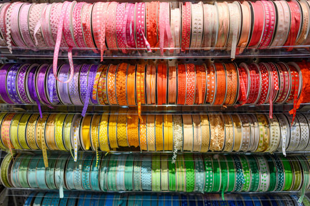 istock Colorful ribbon on rack in craft shop 1370463217