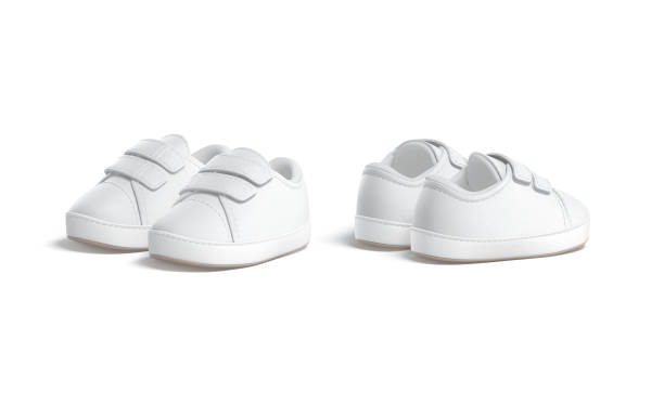 istock Blank white baby shoes pair mockup, half-turned view, side back 1370464504