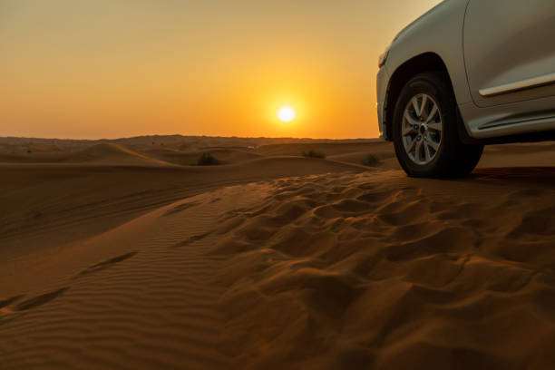 istock Truck in desert with hills 1370465425