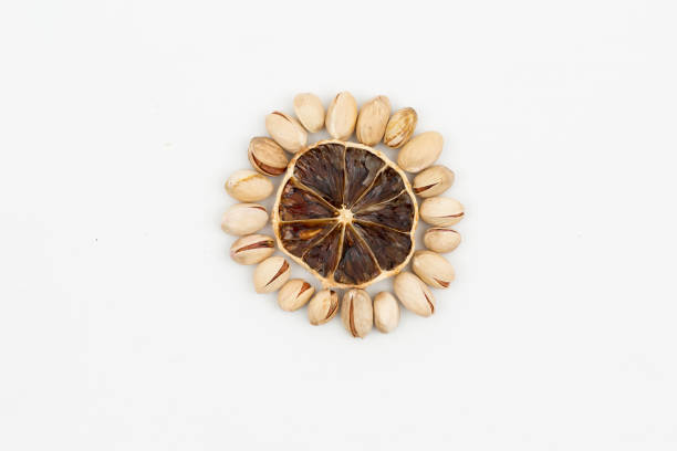 Dried fruit mix on a wooden table made of figs, dates oranges and apricots