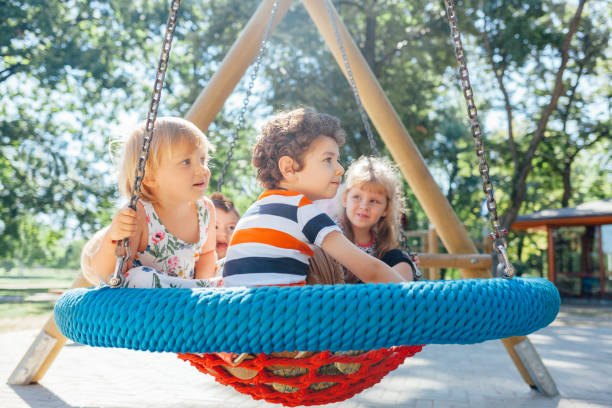 Happy kids playing outdoors. Children at the playground.