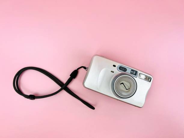 14 February 2022and 90s retro analog old camera with flash built isolated bright pink background. 14 February 2022and 90s retro analog old camera with flash built isolated bright pink background. photographic film camera stock pictures, royalty-free photos & images