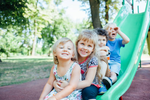istock Happy Kids Playing Outdoors 1370466762
