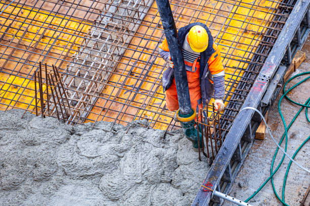 istock Concrete pouring on the construction site. 1370467139