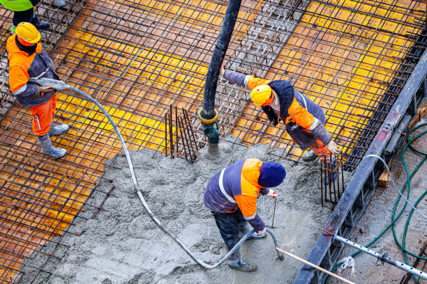 istock Concrete pouring on the construction site. 1370467141