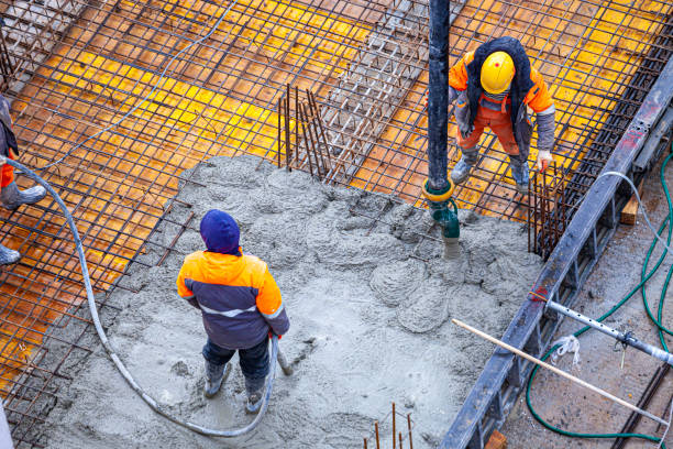 istock Concrete pouring on the construction site. 1370467161