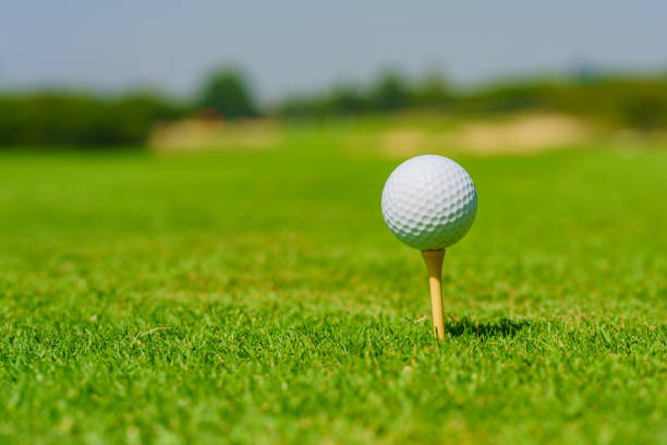 istock Golf ball on tee ready to be shot at golfcourt 1370468015
