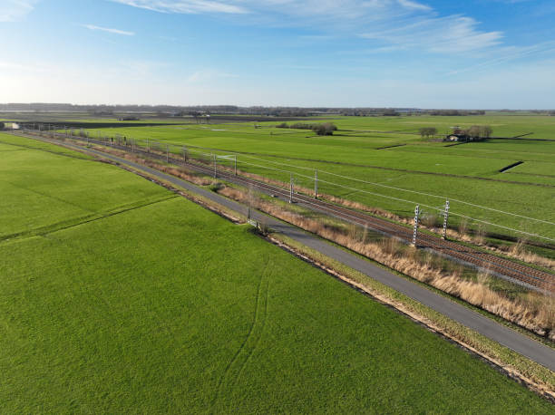 istock Hanzelijn railraod track through a rural landscape during springtime 1370468898