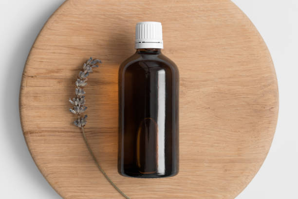 istock Pharmaceutical bottle mockup with lavender on the wooden background. 1370468928