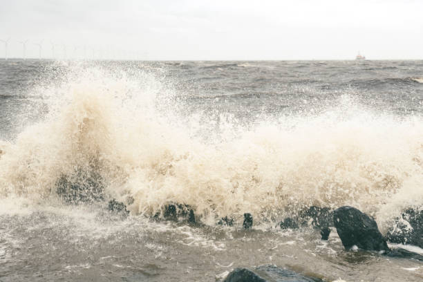 istock Waves at the IJsselmeer hitting a levee during an early springtime storm 1370468936