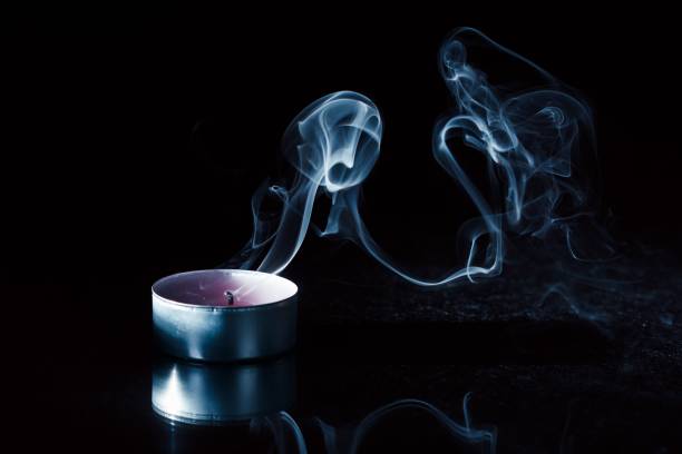 Candle smoke background black bright candlelight candlestick.candle smoke background black bright candlelight candlestick, fire.