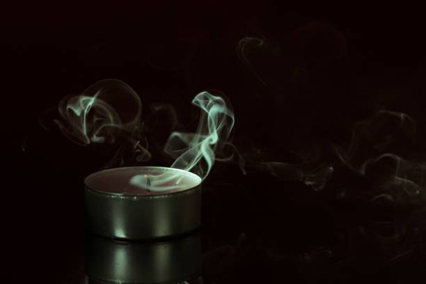 istock Candle smoke background black bright.candle smoke background black bright, death. 1370470212