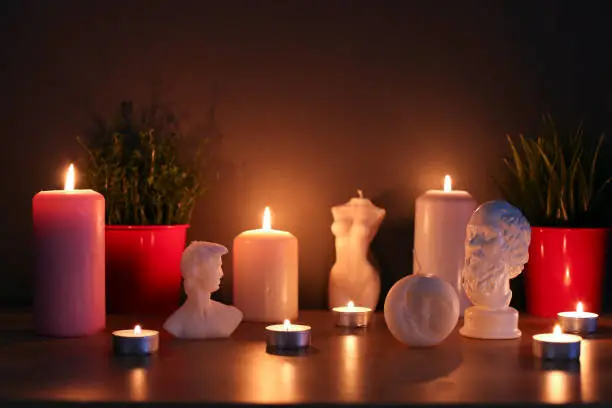 Many burning tealight candles stock images