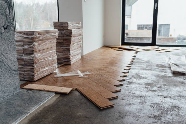 istock laying herringbone parquet at home 1370471827