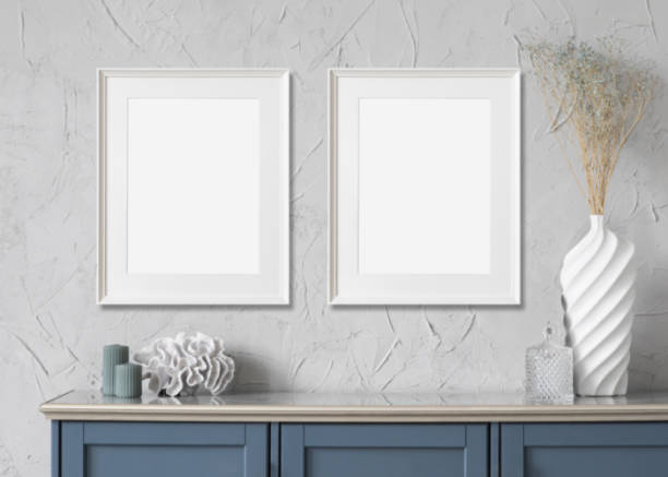 istock Artwork mock-ups in interior design. Two blank white vertical picture frames on a wall 1370472033