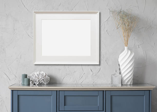 istock Artwork mock-up in interior design. Blank white horizontal picture frame on a wall 1370472037